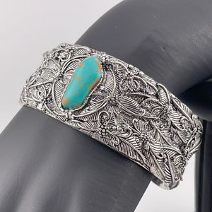 Silver plated southwestern style cuff faux turquoise
